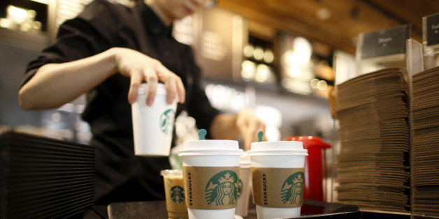 A staff serves beverages at a Starbucks coffee shop in Seoul, South Korea, March 7, 2016. Picture taken March 7, 2016. REUTERS/Kim Hong-Ji