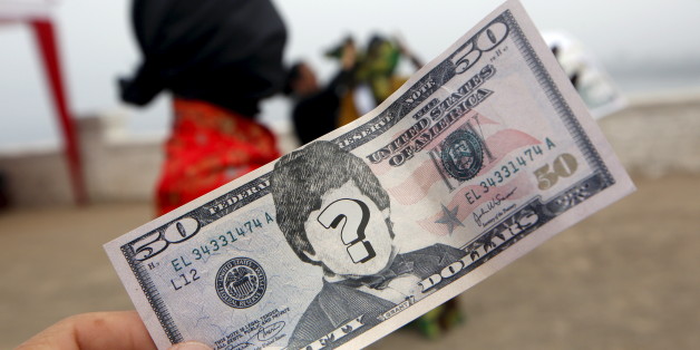 Actors portraying "corrupted people" participate in the "Unmask the Corrupt" event, organized by the Transparency International non-governmental organization to create awareness on corruption, in Lima, November 12, 2015. REUTERS/Mariana Bazo