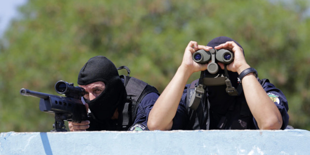 Members of Algeria's special police forces of Research and Intervention Brigade (BRI) take part in an anti-terror drill at the police special forces headquarters in Algiers July 15, 2014. REUTERS/Louafi Larbi (ALGERIA - Tags: POLITICS CRIME LAW)