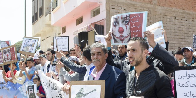 KENITRA, MOROCCO - APRIL 18: Moroccans take part in a protest outside the local Kenitra administration offices over the death of Fatiha, a street vendor who set herself of fire on April 11, 2016 in protest against a member of the local authorities who confiscated her goods, in Kenitra, Morocco on April 18, 2016.