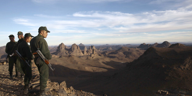 An Algerian Gendarme looks down from the top of the Askrem Mountain near Tamanrasset, some 2,000 km (1,243 miles) south of the Algerian capital Algiers, December 13, 2013. Picture taken December 13, 2013. REUTERS/Ramzi Boudina (ALGERIA - Tags: MILITARY ENVIRONMENT)