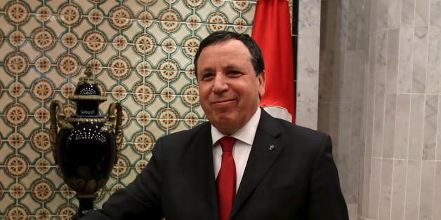 Tunisian Foreign Minister Khemaies Jhinaoui shakes hands with his French counterpart Jean-Marc Ayrault during his visit in Tunis,Tunisia March 17, 2016. REUTERS/Zoubeir Souissi