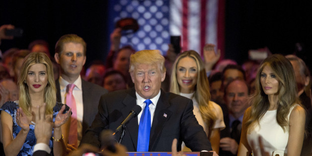 Republican presidential candidate Donald Trump is joined by his wife Melania, right, daughter Ivanka, left, and son Eric, background left, as he speaks during a primary night news conference, Tuesday, May 3, 2016, in New York. (AP Photo/Mary Altaffer)