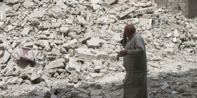A man walks past the rubble of damaged buildings after an airstrike in the rebel held area of Aleppo's Baedeen district, Syria, May 3, 2016. REUTERS/Abdalrhman Ismail