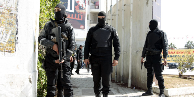 Police officers stand outside the parliament in Tunis March 18, 2015. Gunmen in military uniforms stormed Tunisia's Bardo National Museum, killing 17 foreign tourists and two Tunisians on Wednesday in one of the worst militant attacks in a country that has largely escaped the region's "Arab Spring" turmoil. REUTERS/ Zoubeir Souissi (TUNISIA - Tags: CRIME LAW CIVIL UNREST POLITICS TPX IMAGES OF THE DAY)
