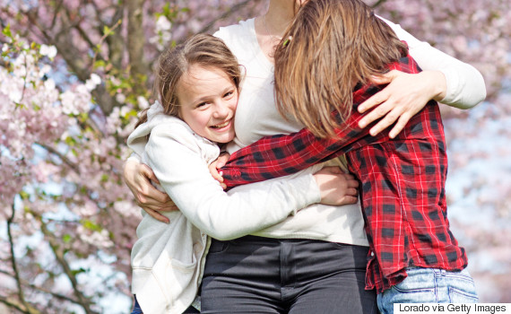 kids hugging mom cherry tree