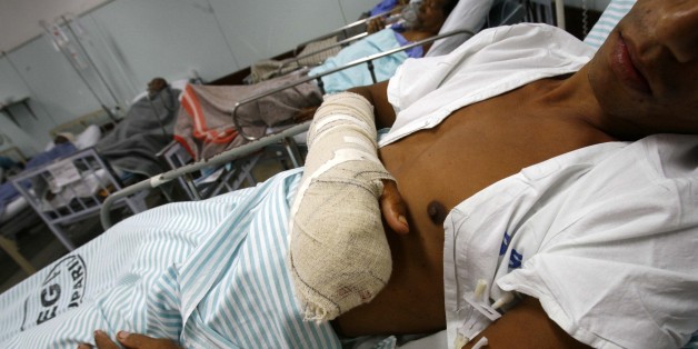 Marcelo Soares dos Santos lies in a hopital after being injured during a shoot-out between police and alleged gang members at the Complexo de Alemao slum in Rio de Janeiro, Thursday, June 28, 2007. Police raided the shantytown and killed 19 suspected drug traffickers on Wednesday. The assault led to the worst urban combat in a two-month siege of the shantytown, where fighting has killed at least 40 people and injured more than 80 since May. (AP photo/Ricardo Moraes)