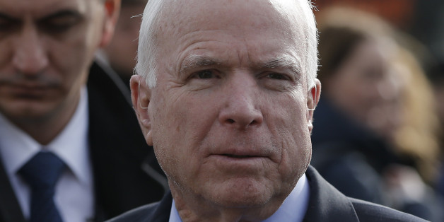 U.S. Senator John McCain arrives on a visit at a migrant center near the village of Adasevci, Serbia February 12, 2016. REUTERS/Marko Djurica