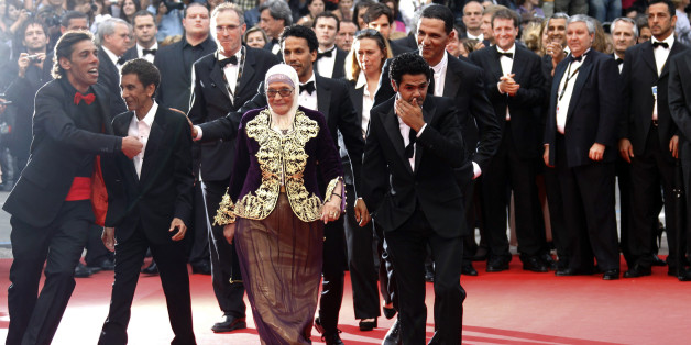 Director Rachid Bouchareb (2nd L) arrives on the red carpet with cast members Chafia Boudraa (C), Sami Bouajila (3rd R), Jamel Debbouze (2nd R) and Roschdy Zem for the screening of the film Hors La Loi (Outside the Law) in competition at the 63rd Cannes Film Festival May 21, 2010. Nineteen films are competing for the prestigious Palme d'Or which will be awarded on May 23. REUTERS/Yves Herman (FRANCE - Tags: ENTERTAINMENT)