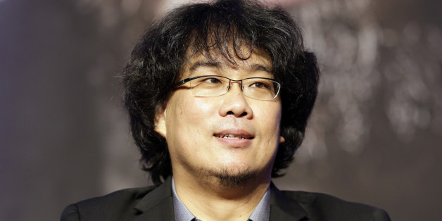 Director Bong Joon-Ho listens to reporters' question during press conference of his new film "Snowpiercer" in Seoul, South Korea, Monday, July 29, 2013. The movie is to be released in South Korea on Aug. 1. (AP Photo/Lee Jin-man)
