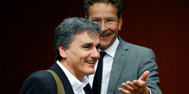 Greek Finance Minister Euclid Tsakalotos and Dutch Finance Minister and Eurogroup President Jeroen Dijsselbloem (R) attend an extraordinary meeting of euro zone finance ministers on Greece at the European Council in Brussels, Belgium, May 9, 2016. REUTERS/Francois Lenoir