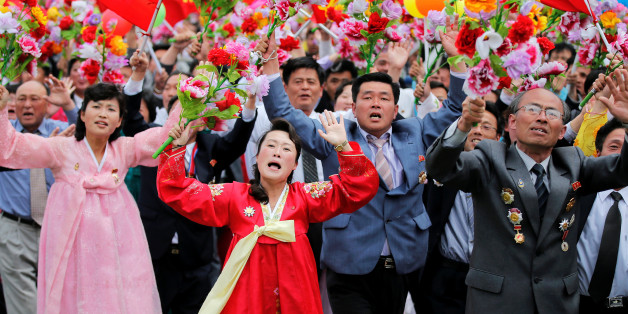 People react as they see North Korean leader Kim Jong Un during a mass rally and parade in the capital's main ceremonial square, a day after the ruling party wrapped up its first congress in 36 years by elevating him to party chairman, in Pyongyang, North Korea, May 10, 2016. REUTERS/Damir Sagolj TPX IMAGES OF THE DAY
