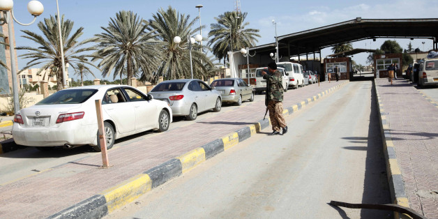 A security checkpoint is pictured at the Ras Jdir border, between Libya and Tunisia, 175 km west of Tripoli December 15, 2014. Libya's recognised government conducted air strikes against rival government forces trying to seize major oil ports in the east and against targets in the west on Monday, witnesses said. An air strike targeted the town of Zuwara near the border to Tunisia, witnesses said. But the rival government kept control of the main crossing in Ras Jdir. Picture taken December 15, 2014. REUTERS/Ismail Zitouny (LIBYA - Tags: POLITICS CIVIL UNREST)
