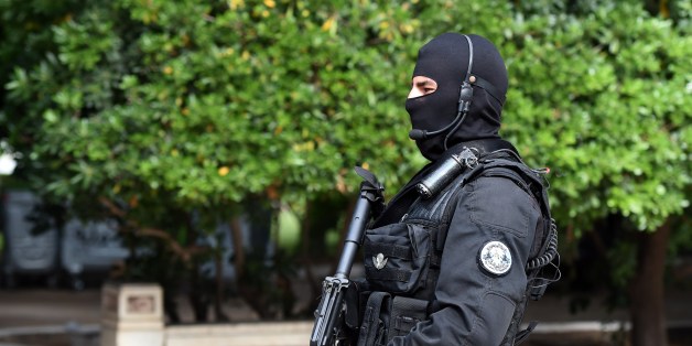 A member of Tunisian special forces stands guard outside the Constituent assembly during the visit of Moroccan King during his visit on May 31, 2014 in Tunis. AFP PHOTO / FETHI BELAID (Photo credit should read FETHI BELAID/AFP/Getty Images)