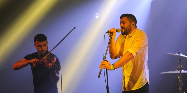 Hamed Sinno (R) and Haig Papazian of Lebanese alternative rock band Mashrou' Leila perform on stage at the 39th 'Le Printemps de Bourges' rock and pop music festival in Bourges, central France, on April 26, 2015. AFP PHOTO / GUILLAUME SOUVANT (Photo credit should read GUILLAUME SOUVANT/AFP/Getty Images)