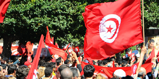 A crowd invades the streets during a demonstration to celebrate Tunisia's independence, Tuesday, March, 20, 2012 in Tunis. On March 20, 1956, Tunisia achieved independence from France led by Habib Bourguiba, who became the first President of the Republic of Tunisia. (AP Photo/Hassene Dridi)