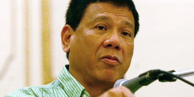 Mayor Rodrigo Duterte of the city of Davao, gestures as he addresses the peace and order council meeting he convened Thursday March 6, 2003 in the wake of the powerful bombing outside the Davao city International Airport in southern Philippines which killed 21 people. Duterte's tough anti-crime methods turned his sprawling Davao port city from a chaotic murder capital in the 1980s to a relatively tranquil and progressive niche in the Philippines' poor and violent south but last week's bombing sh