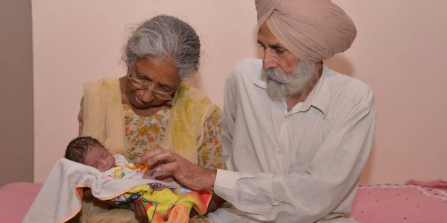 Indian father Mohinder Singh Gill, 79, and his wife Daljinder Kaur, 70, pose for a photograph as they hold their newborn baby boy Arman at their home in Amritsar on May 11, 2016.
An Indian woman who gave birth at the age of 70 said May 10 she was not too old to become a first-time mother, adding that her life was now complete. Daljinder Kaur gave birth last month to a boy following two years of IVF treatment at a fertility clinic in the northern state of Haryana with her 79-year-old husband.
/ AFP / NARINDER NANU (Photo credit should read NARINDER NANU/AFP/Getty Images)