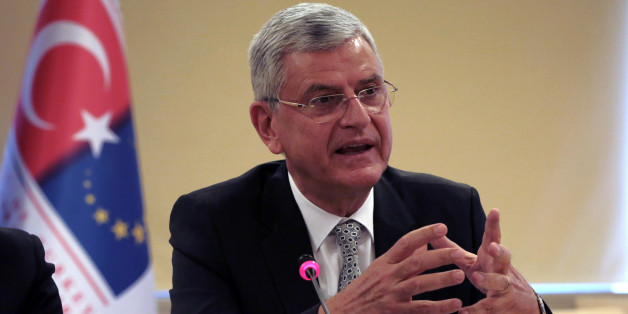 Turkey's EU Affairs Minister Volkan Bozkir speaks during a news conference with Foreign Minister Mevlut Cavusoglu in Ankara, Turkey, Wednesday, May 4, 2016. Turkey has hailed the European Union executive Commission's recommendation to grant Turkish citizens the right to travel to Europe without visas as "a new page" in relations between Turkey and the EU. Cavusoglu said Wednesday's announcement brings Turkish citizens closer than ever to visa-free travel to Europe.(AP Photo/Burhan Ozbilici)