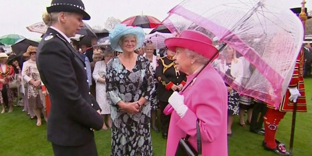 Britain's Queen Elizabeth speaks to Commander Lucy D'Orsi during a garden party at Buckingham Palace in London, in this still image taken from video, Britain, May 10, 2016. REUTERS/ROYAL POOL via Reuters TV. ATTENTION EDITORS - UNITED KINGDOM OUT. NO COMMERCIAL OR EDITORIAL SALES IN UNITED KINGDOM. TPX IMAGES OF THE DAY