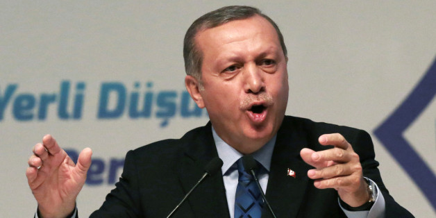 Turkey's President Recep Tayyip Erdogan addresses his supporters in Ankara, Turkey, Thursday, May 12, 2016. Erdogan says his country is gearing up to "clear" the Syrian side of its frontier in response to cross-border fire from the Islamic State group. (AP Photo/Burhan Ozbilici)