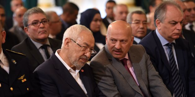 Tunisian Islamist Ennahdha party leader, Rached Ghannouchi (C-L), talks with Vice-President of Nidaa Tounes Ridha Belhaj (C-R) during a ceremony marking the 60th anniversary of Tunisia's independence at the Carthage palace in Tunis, on March 20, 2016, as the country reels from a series of deadly jihadist attacks that have battered its already struggling economy.
Last year, IS claimed attacks on the Bardo museum in Tunis and a popular resort hotel, killing 59 tourists in total, and the suicide bombing of a bus that killed 12 presidential guards.
On March 7, 2016 dozens of jihadists mounted a dawn assault on security installations in Ben Guerdane, which is near the border with unrest-plagued Libya. On March 19 Tunisian authorities said two 'terrorists' were killed close to the southern town of Ben Guerdane near the border with Libya.
/ AFP / FETHI BELAID (Photo credit should read FETHI BELAID/AFP/Getty Images)