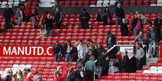 Britain Soccer Football - Manchester United v AFC Bournemouth - Barclays Premier League - Old Trafford - 15/5/16Fans leave the ground as sections of the North Stand are evacuated before the matchReuters / Andrew YatesLivepicEDITORIAL USE ONLY. No use with unauthorized audio, video, data, fixture lists, club/league logos or "live" services. Online in-match use limited to 45 images, no video emulation. No use in betting, games or single club/league/player publications. Please contact your account