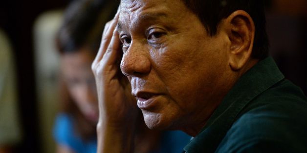 Philippines' President-elect Rodrigo Duterte, speaks to the media for the first time asince he claimed victory in the presidential election, at a restaurant in Davao City, on the southern island of Mindanao on May 15, 2016.
Duterte vowed on May 15 to reintroduce capital punishment and give security forces 'shoot-to-kill' orders. / AFP / TED ALJIBE (Photo credit should read TED ALJIBE/AFP/Getty Images)