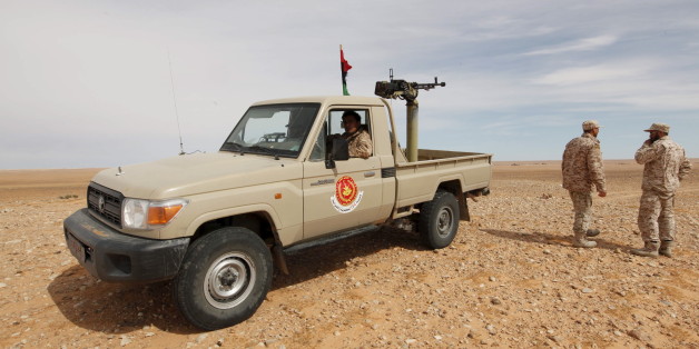 Libyan soldiers stand at a military outpost in Wadi Bey, west of the Islamic State-held city of Sirte, February 23, 2016 REUTERS/Ismail Zitouny