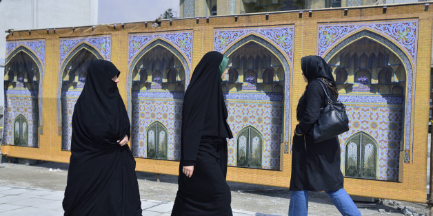Women in the street, dressed in chador,Tehran.
