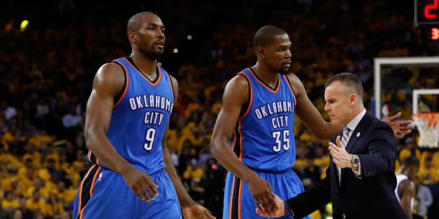 OAKLAND, CA - MAY 16: Billy Donovan of the Oklahoma City Thunder high fives Serge Ibaka #9 and Kevin Durant #35 during game one of the NBA Western Conference Finals against the Golden State Warriors at ORACLE Arena on May 16, 2016 in Oakland, California. NOTE TO USER: User expressly acknowledges and agrees that, by downloading and or using this photograph, User is consenting to the terms and conditions of the Getty Images License Agreement. (Photo by Christian Petersen/Getty Images)
