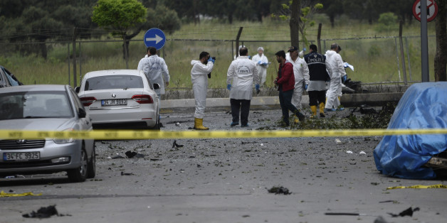 Turkish police forensic officers work at the site of a blast, in Istanbul, Thursday, May 12, 2016. A car bomb targeting a vehicle carrying military personnel lightly wounded several people Thursday, an official said. The explosion occurred inside a car close to the entrance of a military garrison in Istanbul's Sancaktepe neighborhood at the start of the evening rush hour. None of the injured were in a serious condition. (AP Photo)