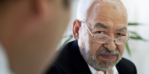 Tunisian leader and founder of the moderate islamist party Ennahda, Rached Ghannouchi, chairs an executive board at the party's headquarters in Tunis, Thursday, Oct. 27, 2011. Authorities say the latest results from Tunisia's landmark elections indicate the moderate Islamist party is holding onto its lead, taking at least 44 percent of seats counted so far for an assembly tasked with writing a new constitution. (AP Photo/Benjamin Girette)