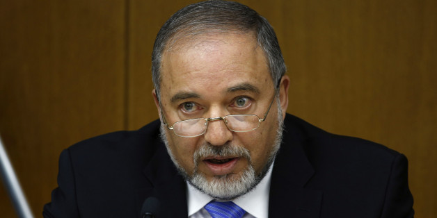 Israel's Foreign Minister Avigdor Lieberman speaks during a news conference at the Knesset, Israel's parliament, in Jerusalem July 7, 2014. Lieberman announced on Monday his party was ending its merger with Prime Minister Benjamin Netanyahu's Likud, saying differences over how to confront the Palestinian Hamas group had contributed to the break. REUTERS/Ronen Zvulun (JERUSALEM - Tags: POLITICS)