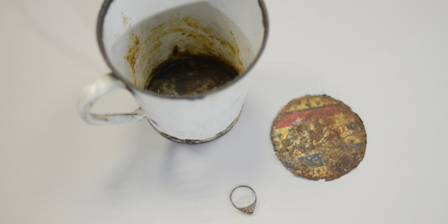 A gold ring that was found by curators of Auschwitz - Birkenau Museum in a metal mug with double bottom is pictured on May 19, 2016 in Oswiecim.
More than 70 years after the liberation of the World War II camp in occupied Poland, staff discovered the jewellery in a rusting enamel mug, one of thousands of pieces of kitchenware now on display at the museum.
/ AFP / BARTOSZ SIEDLIK (Photo credit should read BARTOSZ SIEDLIK/AFP/Getty Images)