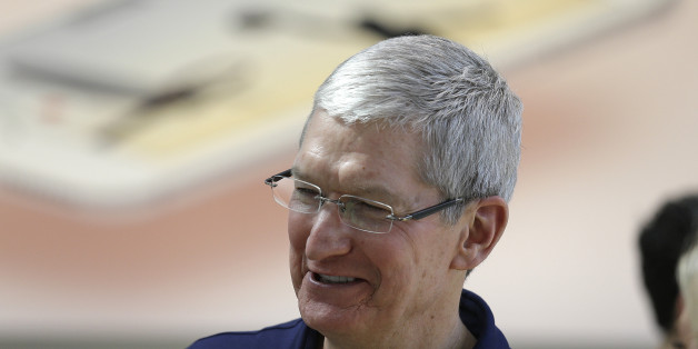 Apple CEO Tim Cook visits with customers at the Apple Store Thursday, March 31, 2016, in Palo Alto, Calif. The new Apple iPhone SE and 9.7 inch iPad Pro were available for sale on Thursday. (AP Photo/Eric Risberg)
