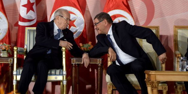 Tunisian President Beji Caid Essebsi(L) and prime minister Habib Essid attend a May Day celebration on May 1, 2016 in the capital Tunis. / AFP / FETHI BELAID (Photo credit should read FETHI BELAID/AFP/Getty Images)