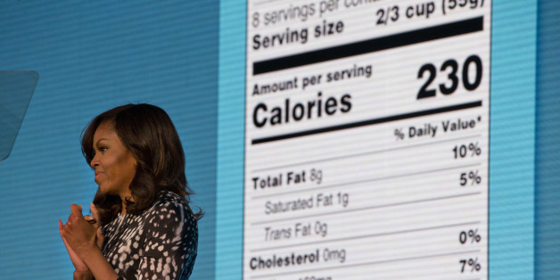 First lady Michelle Obama announces a makeover for food nutrition labels with calories listed in bigger, bolder type and a new line for added sugars, while speaking to the Building a Healthier Future Summit in Washington, Friday, May 20, 2016. (AP Photo/Jacquelyn Martin)