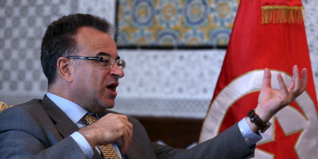 Tunisia's Finance Minister Slim Chaker gestures as he speaks with Reuters journalists in Tunis, Tunisia, October 26, 2015. Tunisia, frustrated by the international community's failure to deliver on pledges of economic support, is asking the Group of Eight major nations for a five-year rescue programme worth $25 billion. Chaker told a Reuters the billions of dollars of aid were needed to ensure Tunisia's political progress was not reversed. Picture taken October 26, 2015. REUTERS/Zoubeir Souissi