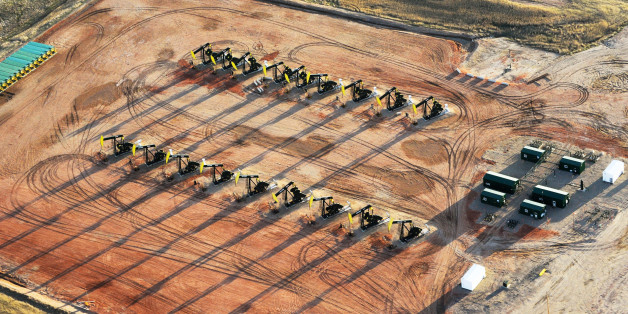 Eighteen oil pumpjacks are seen on a Hess well pad near Tioga, North Dakota April 30, 2016.