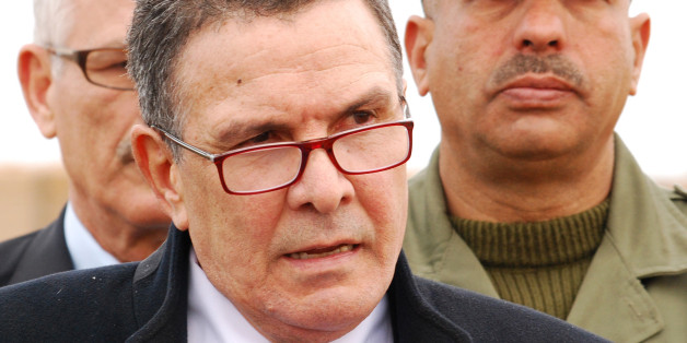 Tunisian Defence minister Farhat Horchani, attends a presentation of the so-called obstacle system, aimed at preventing Islamists militants from entering the Tunisian territory, Saturday Feb.6, 2016 in near Ben Guerdane, eastern Tunisia, close to the border with Libya . (AP Photo/Benjamin Wiacek)