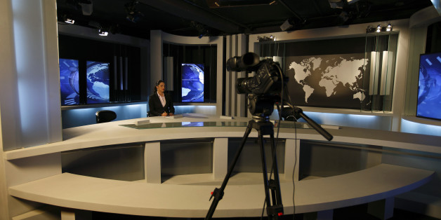 Nourelyakin Meghrich, an Ennahar TV News anchorwoman is seen at a TV news studio in Algier May 8, 2012. In the past few months, several independent Algerian television channels have started broadcasting, undermining the monopoly of state television. The new stations were set up after President Abdelaziz Bouteflika, under pressure to reform after the ?Arab Spring? uprisings in neighbouring states, promised to open up the country?s tightly-controlled electronic media. REUTERS/Zohra Bensemra (ALGER