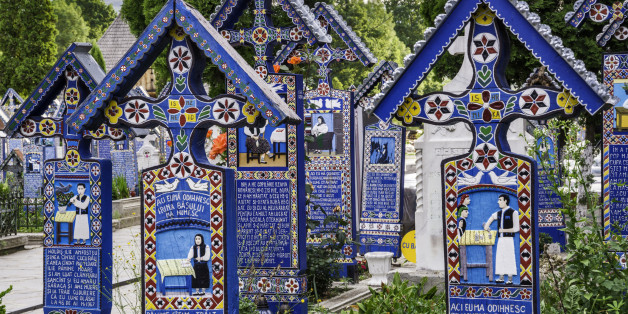 Carved wooden panels with epitaphs at crosses on graves, Merry Cemetery (Cimitirul Vesel) in Sapanta, Maramures Region, Romania.