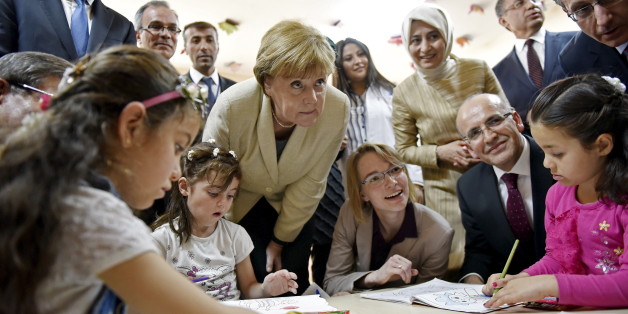EU Council President Donald Tusk, German Chancellor Angela Merkel, Turkish Prime Minister Ahmet Davutoglu's wife Sare and European Commission Vice-President Frans Timmermans visit a group of children in the kindergarten in Nizip refugee camp near Gaziantep, Turkey, April 23, 2016. Bundesregierung/Steffen Kugler/Handout via REUTERS ATTENTION EDITORS - THIS IMAGE WAS PROVIDED BY A THIRD PARTY. EDITORIAL USE ONLY. NO RESALES. NO ARCHIVE. TPX IMAGES OF THE DAY