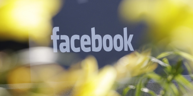 This Friday, May 18, 2012, file photo shows Facebook's headquarters behind flowers in Menlo Park, Calif. Facebook is letting its nearly 1 billion users vote on changes to its privacy policy beginning on Friday, June 1, 2012. This is the second time Facebook let users vote on policy changes. The first time was in 2009 when Facebook was a much smaller, privately held company with about 200 million users. (AP Photo/Paul Sakuma,File)