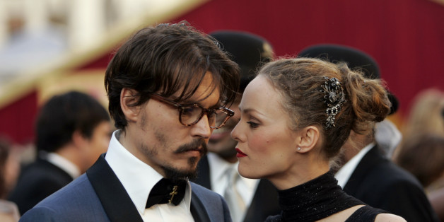 Johnny Depp shares a moment with his partner, French actress Vanessa Paradis, as they arrive atthe 77th Academy Awards Sunday, Feb. 27, 2005, in Los Angeles. Depp is nominated for an Oscar for best actor in a leading role for his work in "Finding Neverland." (AP Photo/Kevork Djansezian)
