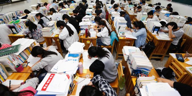 This photo taken on May 24, 2016 shows senior high school students studying at night to prepare for the college entrance exams at a high school in Lianyungang, east China's Jiangsu province.
The three-day 2016 college entrance exam will start on June 7. / AFP / STR / China OUT (Photo credit should read STR/AFP/Getty Images)
