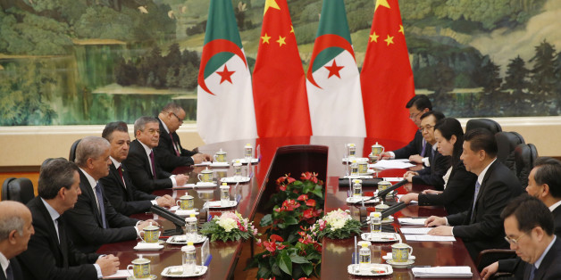 Algeria's Prime Minister Abdelmalek Sellal, third left, shakes hands with Chinese President Xi Jinping, third right, at the Great Hall of the People in Beijing, China, Wednesday, April 29, 2015. (Kim Kyung-hoon/Pool Photo via AP)