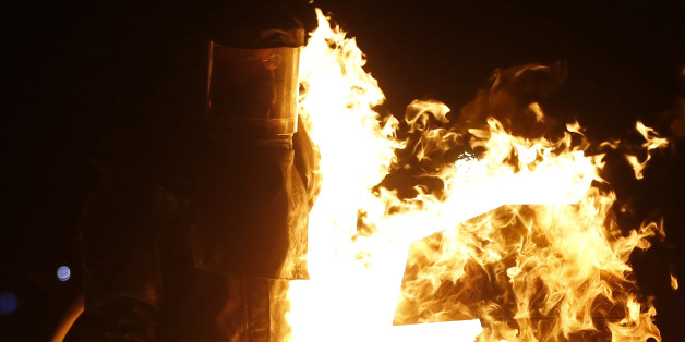 Seph, his Playa name, is hit by flames while competing on the Dance Dance Immolation installation during the Burning Man 2013 arts and music festival in the Black Rock Desert of Nevada, August 31, 2013. The federal government issued a permit for 68,000 people from all over the world to gather at the sold out festival, which is celebrating its 27th year, to spend a week in the remote desert cut off from much of the outside world to experience art, music and the unique community that develops. REU