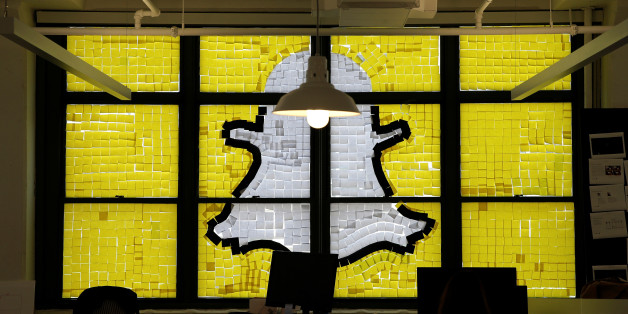 An image of the Snapchat logo created with Post-it notes is seen in the windows of Havas Worldwide at 200 Hudson Street in lower Manhattan, New York, U.S., May 18, 2016, where advertising agencies and other companies have started what is being called a "Post-it note war" with employees creating colorful images in their windows with Post-it notes. REUTERS/Mike Segar TPX IMAGES OF THE DAY